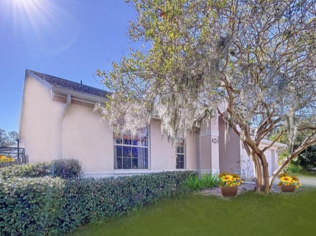 view of side of home featuring a yard