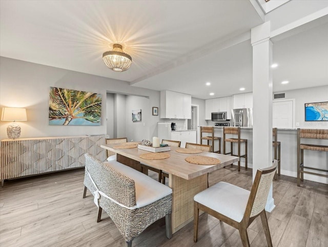 dining room with light hardwood / wood-style floors