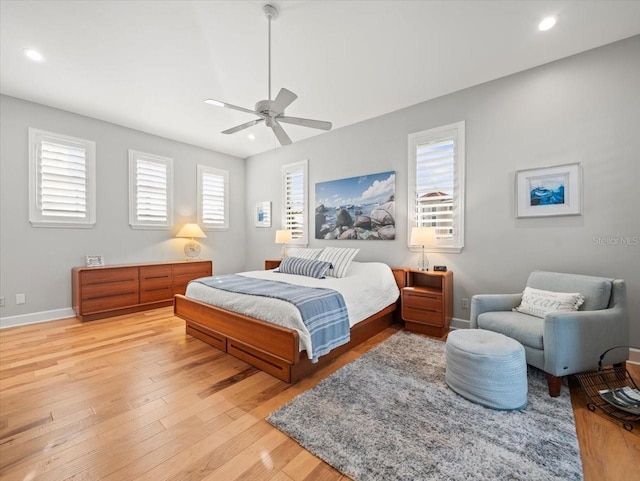 bedroom with ceiling fan and light wood-type flooring