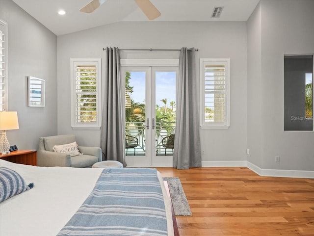 bedroom with access to exterior, ceiling fan, french doors, hardwood / wood-style floors, and vaulted ceiling