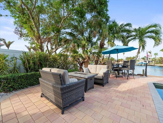 view of patio / terrace with a water view