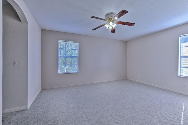 carpeted empty room with ceiling fan