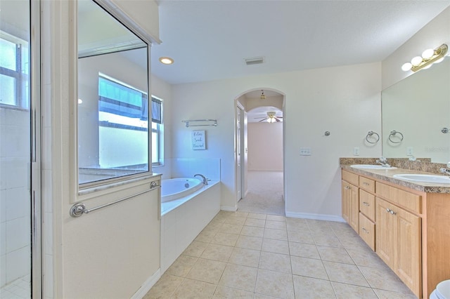 bathroom featuring tile patterned flooring, vanity, ceiling fan, and independent shower and bath