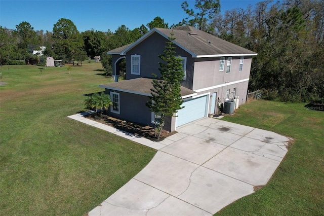 view of property exterior with central AC, a garage, and a lawn