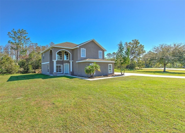 view of front of property with a front lawn