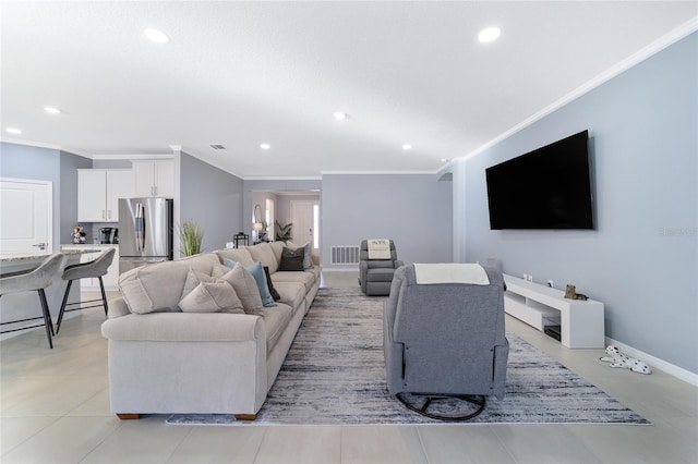 tiled living room featuring crown molding