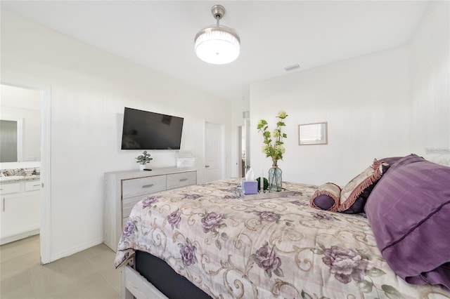 bedroom with light tile patterned floors