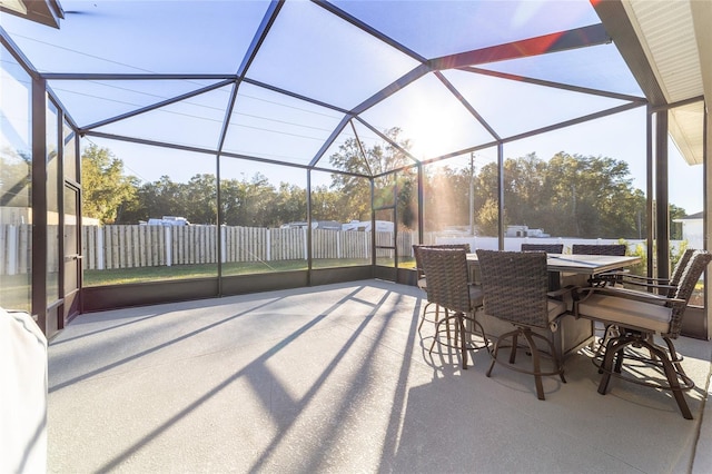 view of patio featuring a lanai