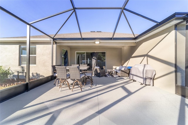 view of patio / terrace with glass enclosure and outdoor lounge area