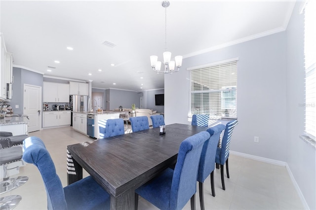 dining area featuring a notable chandelier, light tile patterned flooring, and ornamental molding