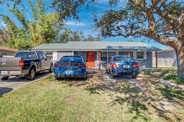 ranch-style house with a front lawn