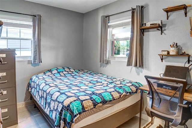 bedroom featuring light tile patterned floors