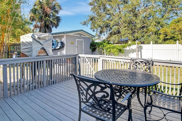 deck with a storage shed