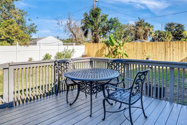 wooden deck featuring a yard