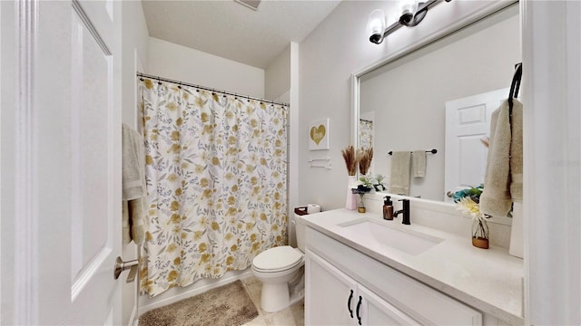 full bathroom with vanity, shower / bath combo, a textured ceiling, and toilet