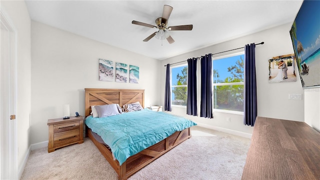 bedroom featuring ceiling fan and light colored carpet