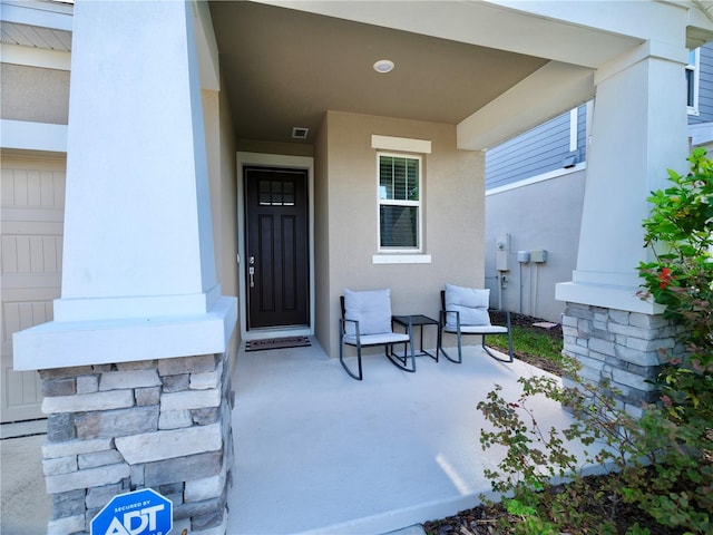 entrance to property with a porch