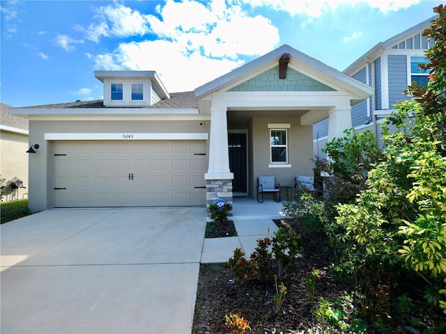 view of front of house with a porch and a garage