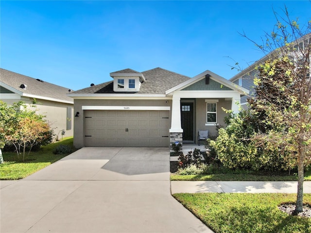 view of front of property featuring a porch and a garage