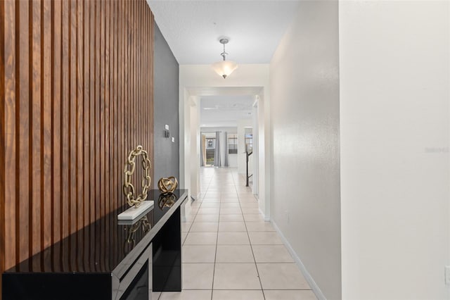 corridor featuring light tile patterned floors