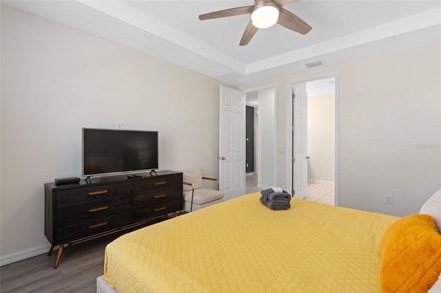 bedroom featuring ceiling fan and light hardwood / wood-style flooring