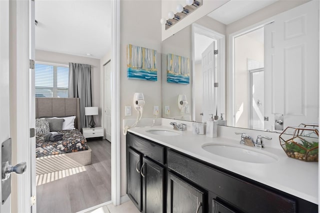 bathroom featuring hardwood / wood-style floors and vanity