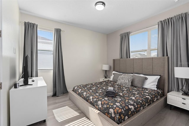 bedroom with wood-type flooring