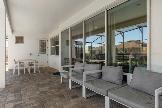 view of patio with a lanai