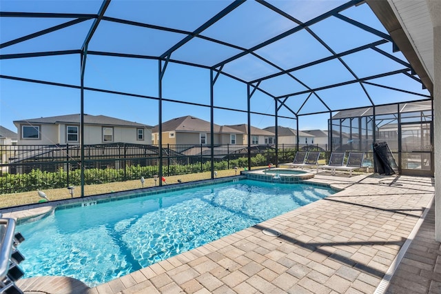 view of swimming pool featuring a lanai, an in ground hot tub, and a patio