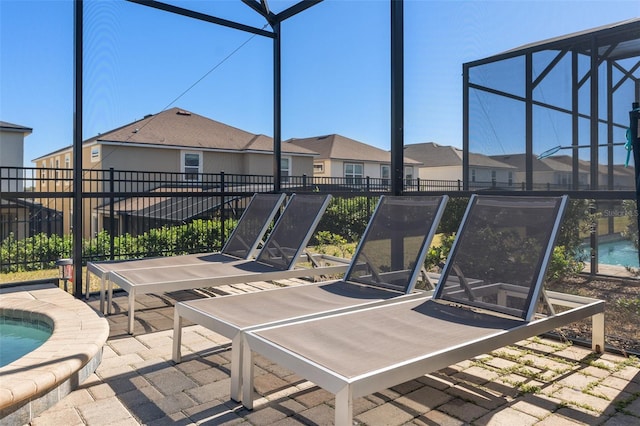 view of patio / terrace featuring a lanai