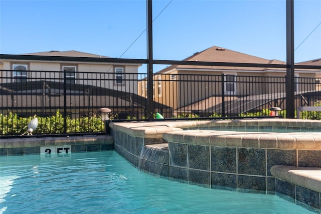 view of swimming pool featuring pool water feature