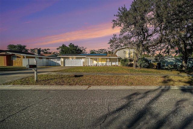 view of front of house with a yard