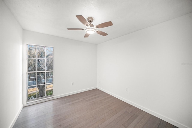 unfurnished room with ceiling fan, a textured ceiling, and hardwood / wood-style flooring