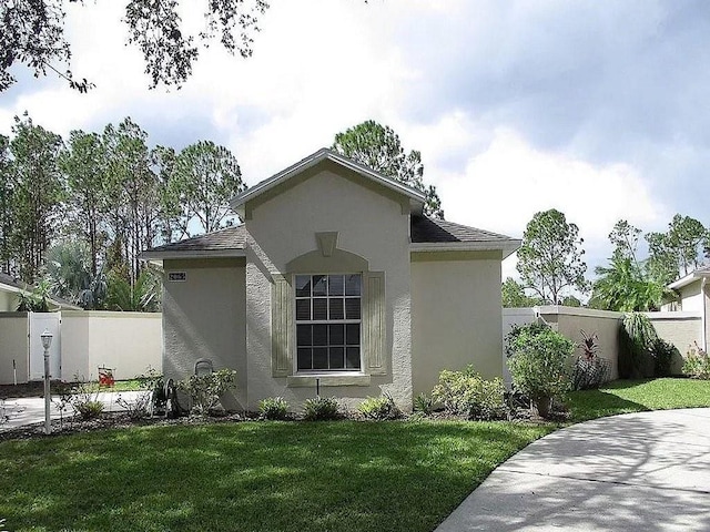 view of home's exterior featuring a lawn