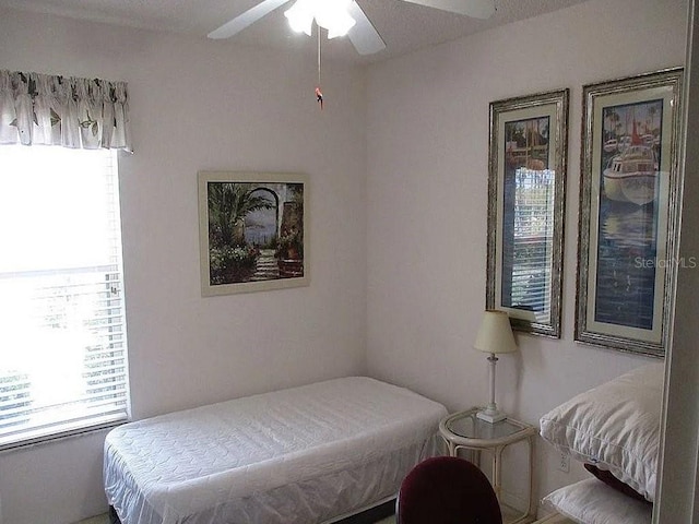 bedroom featuring ceiling fan