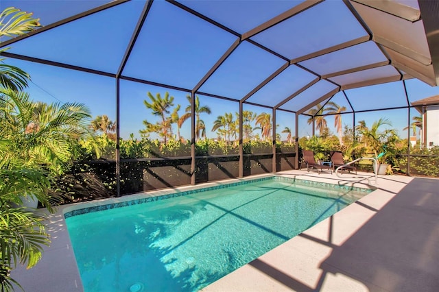 view of pool with a lanai and a patio