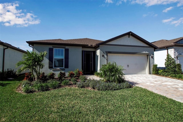 single story home with a front lawn and a garage