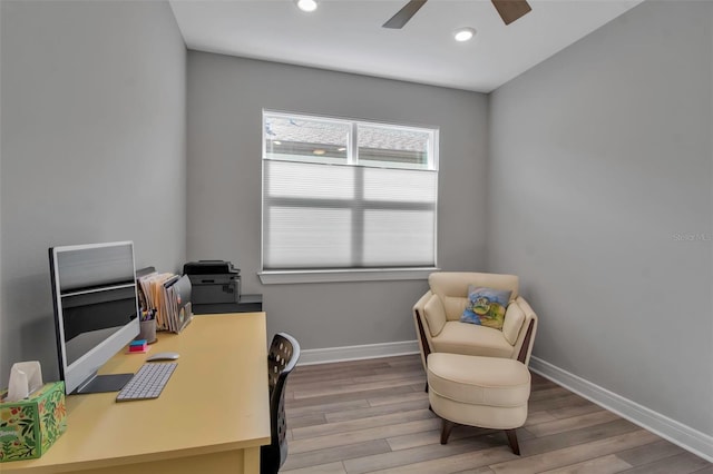 home office with ceiling fan and hardwood / wood-style floors