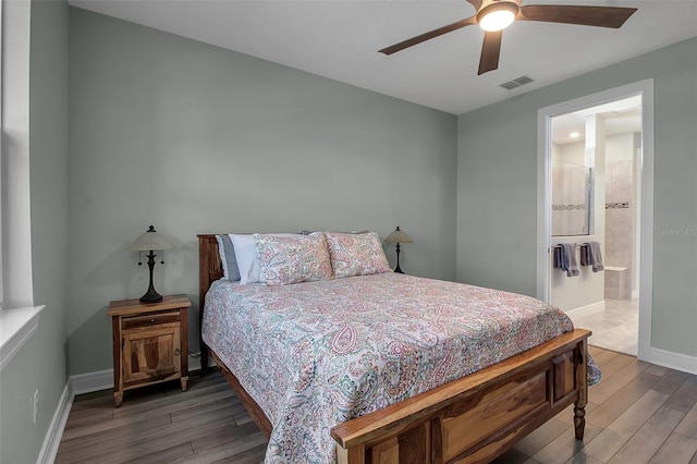 bedroom featuring ceiling fan, hardwood / wood-style flooring, and ensuite bathroom