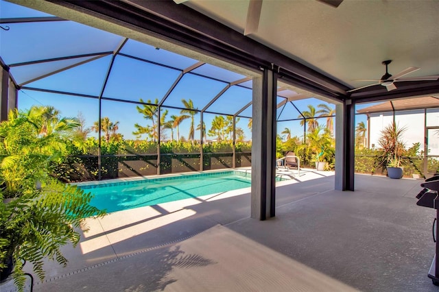 view of pool featuring a lanai, a patio, and ceiling fan