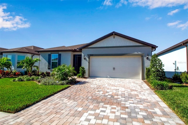 ranch-style house with a garage and a front lawn