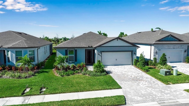 ranch-style home with a garage and a front lawn