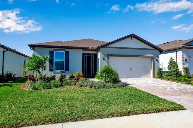 view of front facade with a garage and a front yard