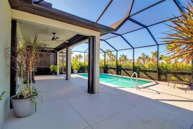 view of swimming pool with ceiling fan, a patio area, and a lanai