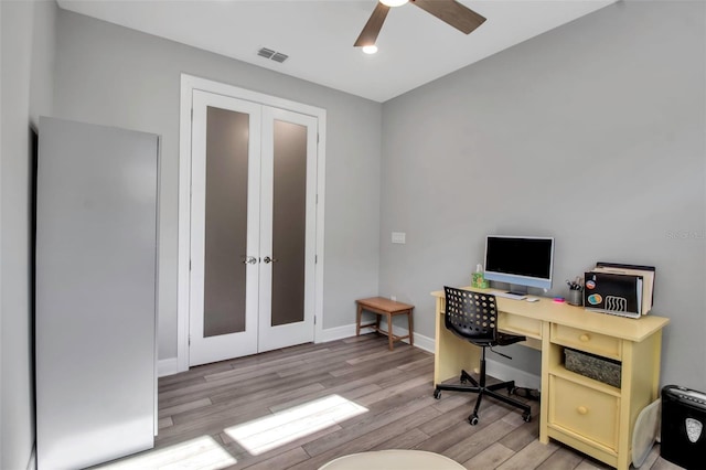 office with french doors, ceiling fan, and light hardwood / wood-style floors