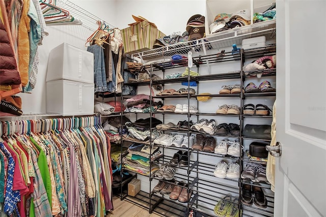 walk in closet featuring hardwood / wood-style flooring