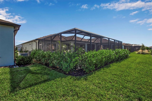 view of yard with glass enclosure