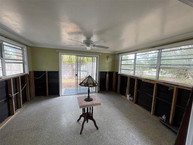 miscellaneous room with ceiling fan and crown molding