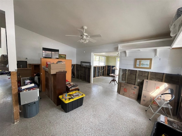 interior space with ceiling fan and lofted ceiling