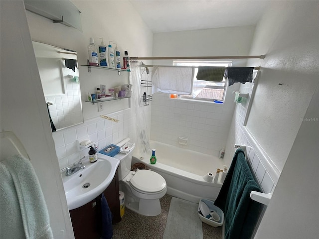 full bathroom with tile walls, vanity, shower / bath combo, and toilet